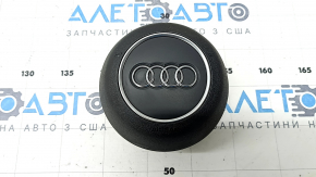 Black steering wheel airbag for the driver's side of the Audi A4 B9 17-25, with chrome accents.