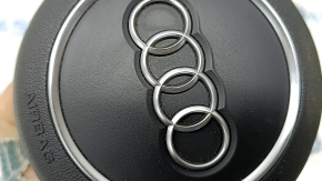 Black steering wheel airbag for the driver's side of the Audi A4 B9 17-25, with chrome accents.