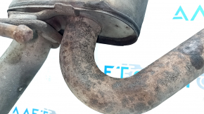 The rear muffler with the barrel of a 19-21 LUV Buick Encore is rusty and the barrel is dented.