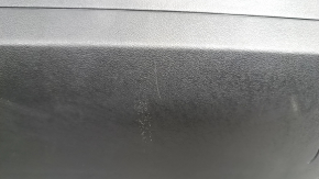 Tesla Model Y 20-25 passenger right knee airbag with black trim, scratches