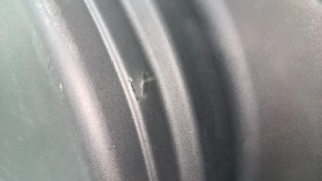 The trunk tray for the spare tire of an Audi A4 B8 08-16 sedan has scratches, a dent, and a tear.