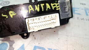 The driver's seat heating button on a Hyundai Santa FE Sport 13-16 is worn out.