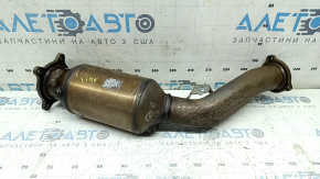 The exhaust pipe with a catalytic converter for the Audi A4 B8 13-16 rest 2.0T is dented.