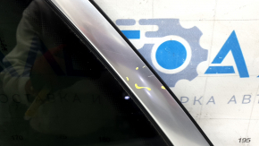 Rear left window with blind glass for an Audi Q5 80A 18-24 with chrome molding, scratches on the chrome, and a defective seal.