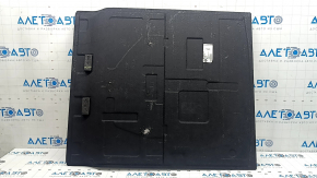 The trunk floor of a BMW 3 G20 19-25 is black and has tears, without a spare tire.