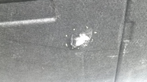 The trunk floor of a BMW 3 G20 19-25 is black and has tears, without a spare tire.