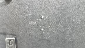 The trunk floor of a BMW 3 G20 19-25 is black and has tears, without a spare tire.