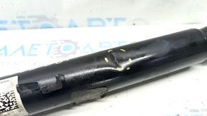 The rear left shock absorber of the BMW 3 G20 19-25 2.0T RWD is dented.