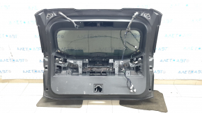 A bare tailgate with glass for a Nissan Rogue 21-24 SV, electric and keyless, with wiring, scratches.