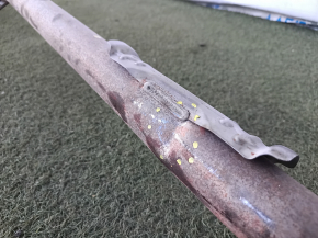 The exhaust pipe with the rear barrel of a Honda CRV 20-22 hybrid is dented.