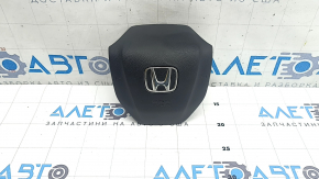 The Honda CRV 20-22 driver's steering wheel airbag is black and scratched.