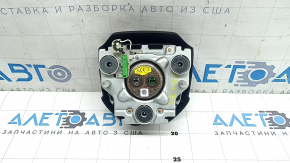 The Honda CRV 20-22 driver's steering wheel airbag is black and scratched.