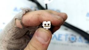 The right Kia Sorento 21-25 trunk lid position sensor has broken mounts.