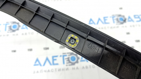 The right Kia Sorento 21-25 trunk lid position sensor has broken mounts.