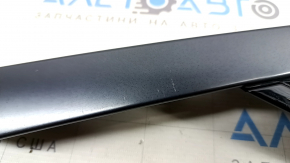 Right rear fender triangle cap for Nissan Ariya 23-25 with black molding, scratches