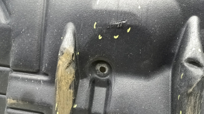 The right engine guard for a Toyota Camry V55 2015-2017 is worn, pinched, and torn.