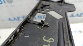The front bumper license plate holder for the Nissan Ariya 23-25 has a broken guide.