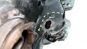 The rear subframe of an Infiniti QX50 19-25 FWD has a dented camber bolt.