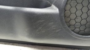 Front left door panel for a 17-20 Nissan Rogue, black with black plastic insert, leather armrest, needs cleaning, scratches