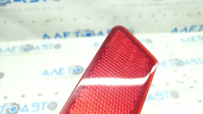 Left rear bumper reflector for Nissan Rogue 17-20, scratches in paint
