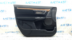 Black front left door panel for a Honda CRV 17-22, black fabric armrest, black fabric insert, light wood molding, needs cleaning, scratches, scuffs