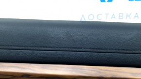 Black front left door panel for a Honda CRV 17-22, black fabric armrest, black fabric insert, light wood molding, needs cleaning, scratches, scuffs