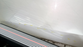 The front left door of a Honda CRV 17-22, white, NH-883P, is dented, has dents, and scratches.