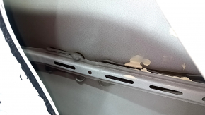 The front left door of a Honda CRV 17-22, white, NH-883P, is dented, has dents, and scratches.