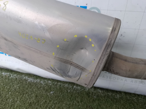 The exhaust pipe with the rear barrel of a Honda CRV 20-22 hybrid is dented in the resonator.