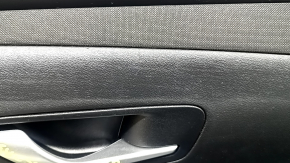 Hyundai Tucson 22-24 black front right door panel with black cloth insert, black armrest, chrome molding with black gloss, with handle, scratches, worn