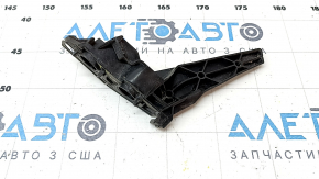 The front bumper mount, right, for a VW Jetta 19-21 is broken.