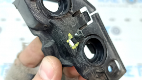 The front bumper mount, right, for a VW Jetta 19-21 is broken.