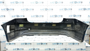 The rear bumper of a 19-21 VW Jetta is bare and blue, with paint peeling off.