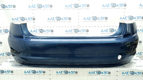 The rear bumper of a 19-21 VW Jetta is bare and blue, with paint peeling off.