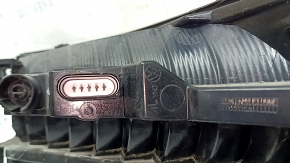 Left outer fender light for a 2019 VW Jetta, scratches, glued on