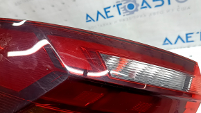 Left outer fender light for a 2019 VW Jetta, scratches, glued on