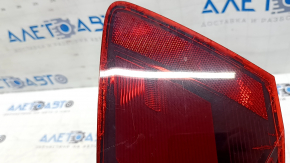 Right outer fender light for a 19-19 VW Jetta, scratches and cracks