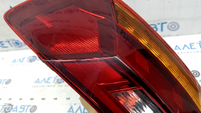 Right outer fender light for a 19-19 VW Jetta, scratches and cracks