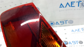 Right outer fender light for a 19-19 VW Jetta, scratches and cracks