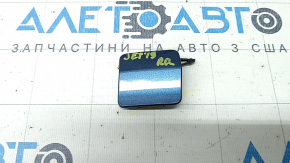 The towing hook cap for the rear bumper of a VW Jetta 19-21 is broken.