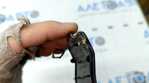 The towing hook cap for the rear bumper of a VW Jetta 19-21 is broken.