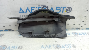The lower control arm lining under the rear left spring is dented for an Audi A6 C8 19-25.