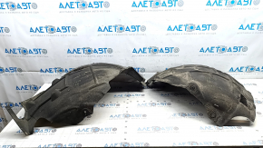 The front left fender liner of the Audi E-Tron 19-23 is broken in half.