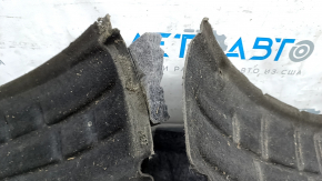 The front left fender liner of the Audi E-Tron 19-23 is broken in half.