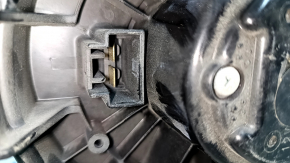 The heater fan motor on a 1993 Honda Accord has a broken mount.