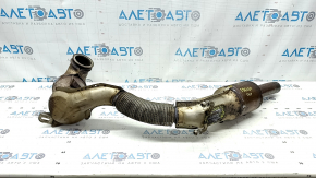 The exhaust pipe with catalytic converters for a VW Jetta 19-21 1.4T is rusty and the mesh is torn.