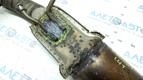 The exhaust pipe with catalytic converters for a VW Jetta 19-21 1.4T is rusty and the mesh is torn.