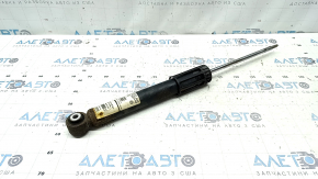 The rear left shock absorber of a VW Jetta 19-26 is rusty.