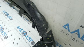 The front bumper lower absorber of Toyota Venza 21-24 is dented, worn, and has cracks.
