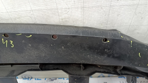 The front bumper lower absorber of Toyota Venza 21-24 is dented, worn, and has cracks.